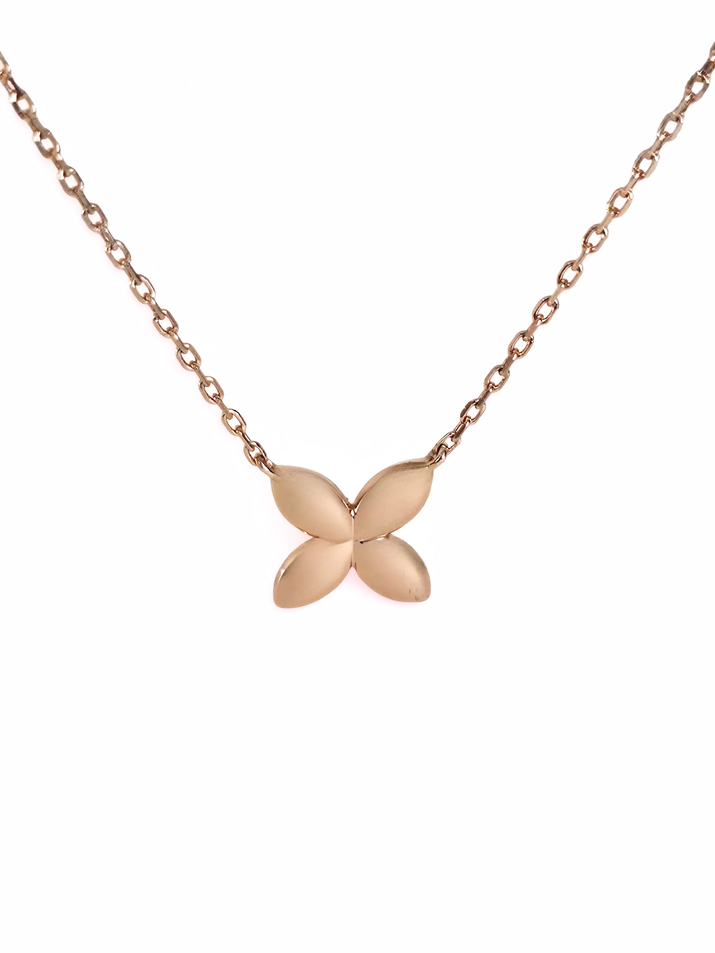Rose gold butterfly necklace on a white background- front