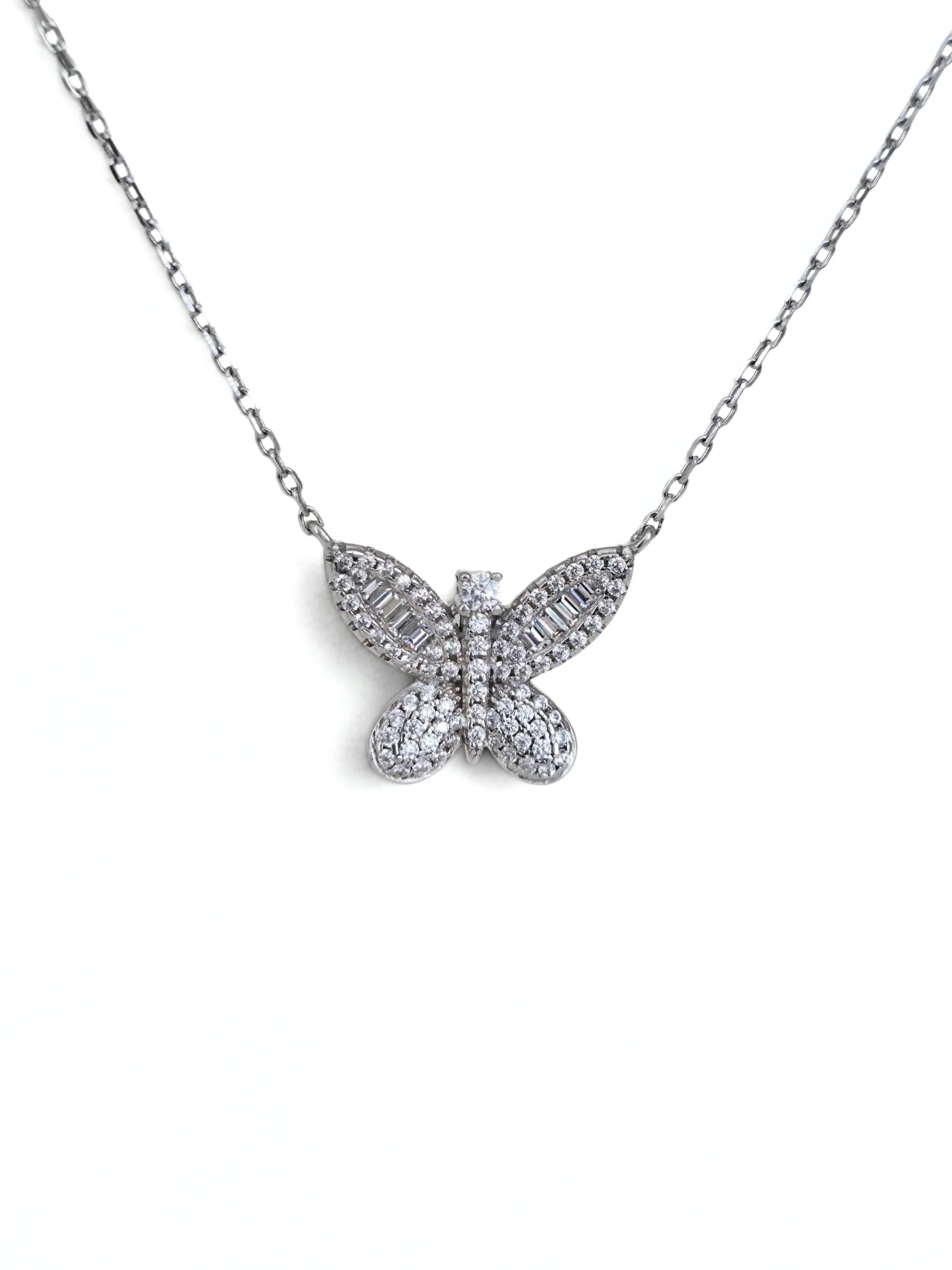 Butterfly-shaped diamond necklace on a white background- shimmering butterfly silver- further