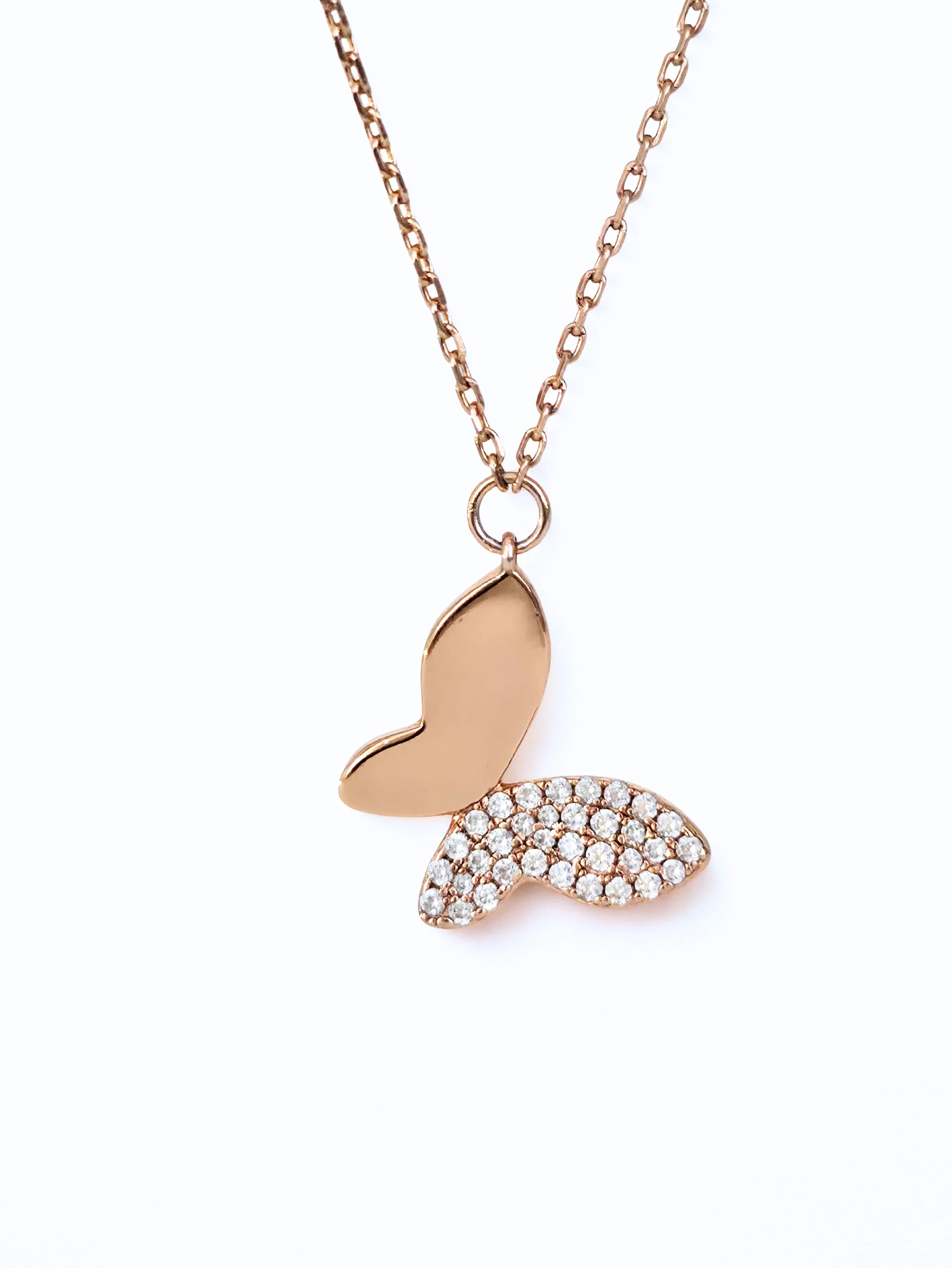 Rose gold butterfly pendant necklace on a white background- chic butterfly necklace mdeuim shot