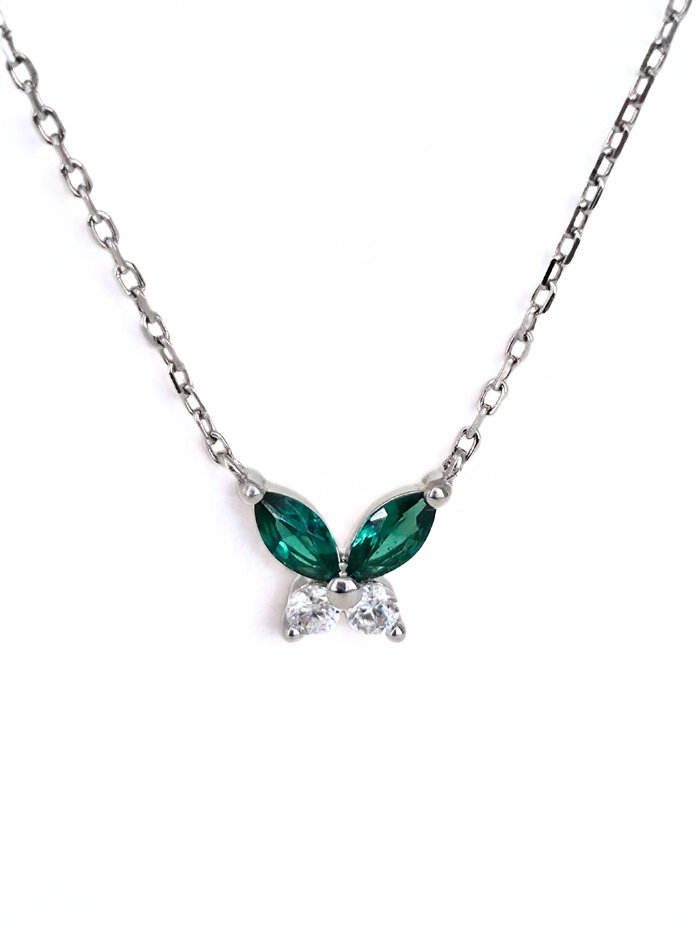 petite butterfly necklace silver Necklace with green gemstones on a white background- front