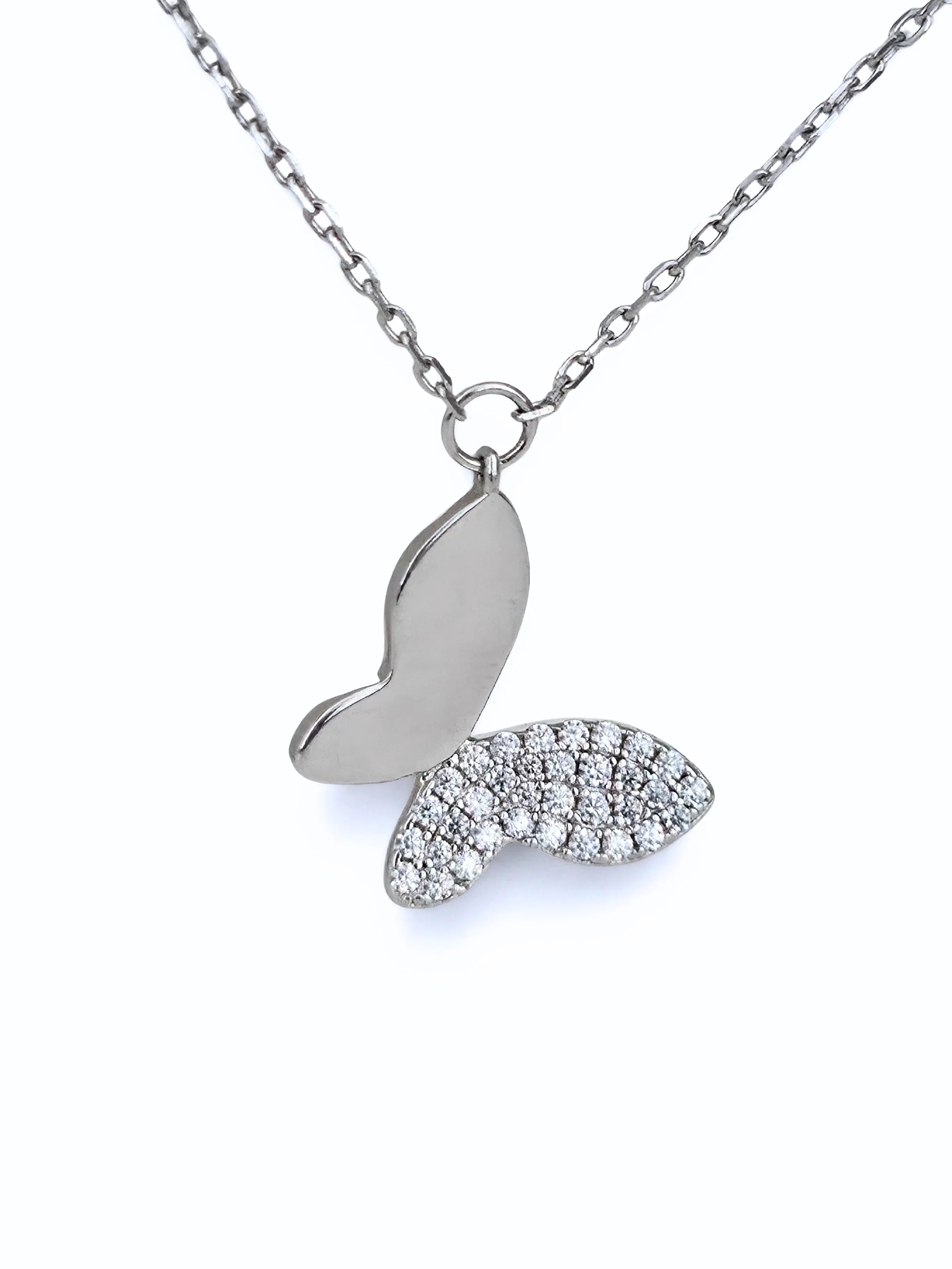 Silver butterfly necklace with diamond accents on a white background- chic butterfly necklace silver - close up