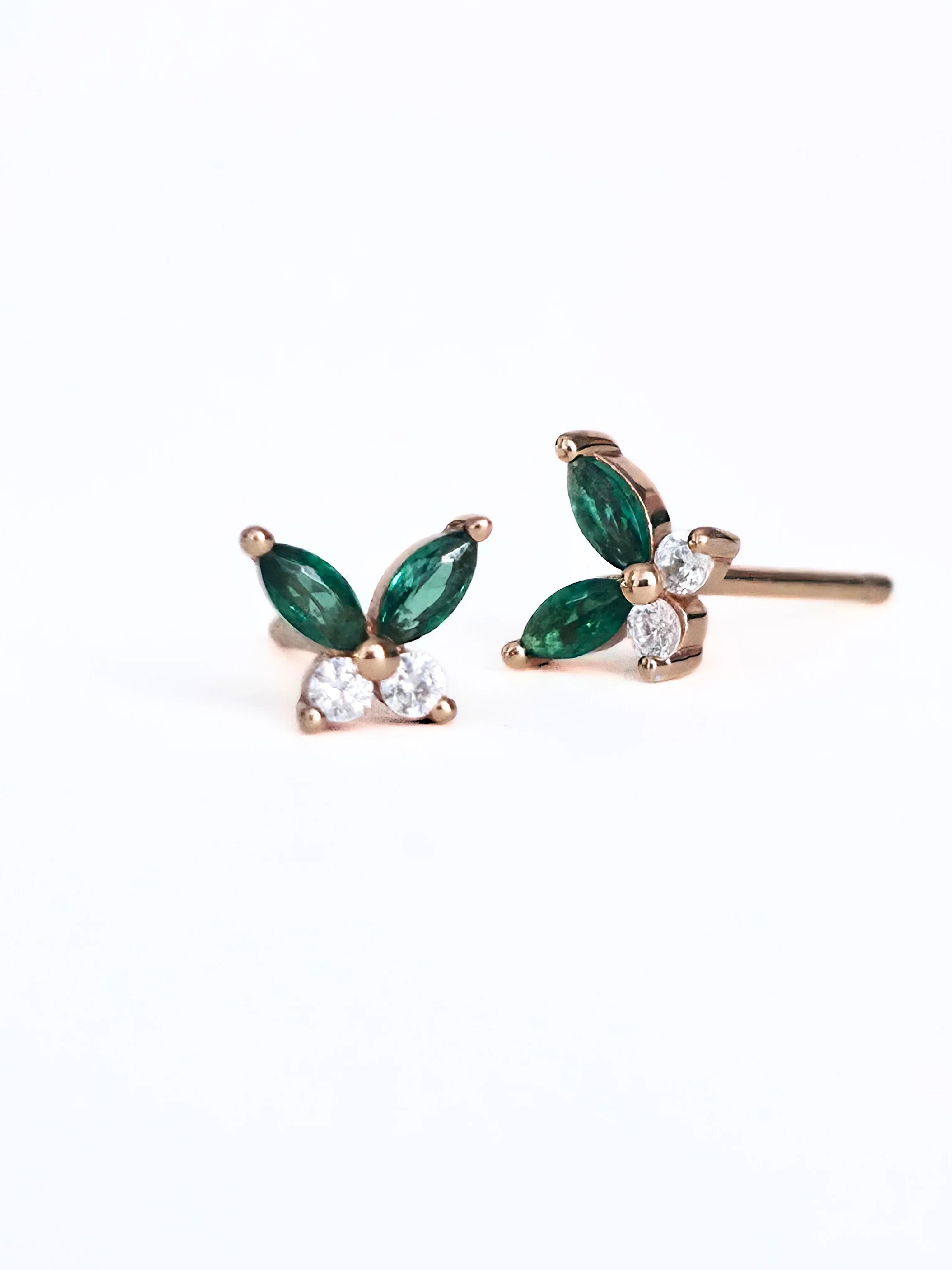 Rose gold earrings with green gemstones on a white background- pair