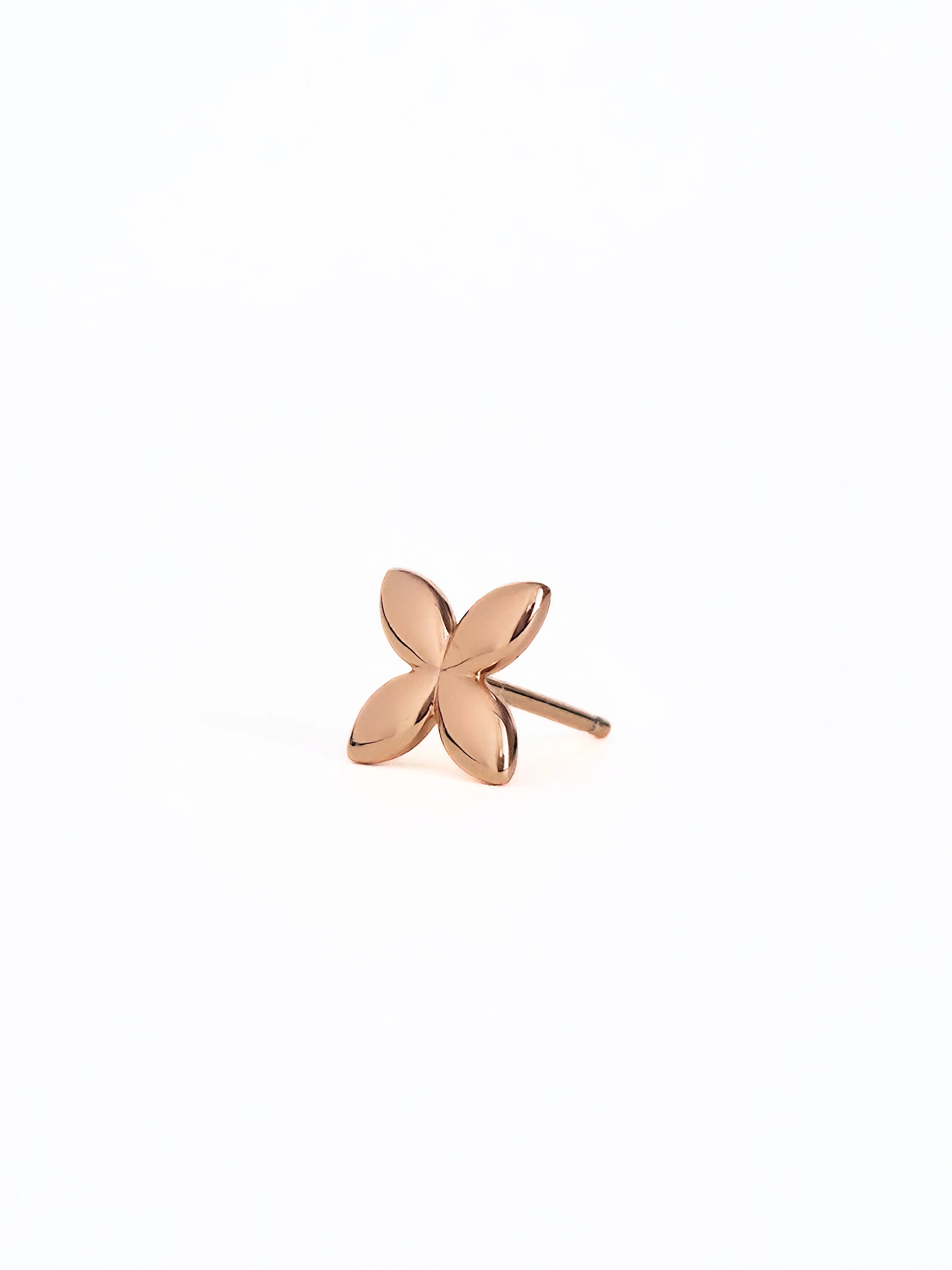 Rose gold flower-shaped earring on a white background= front