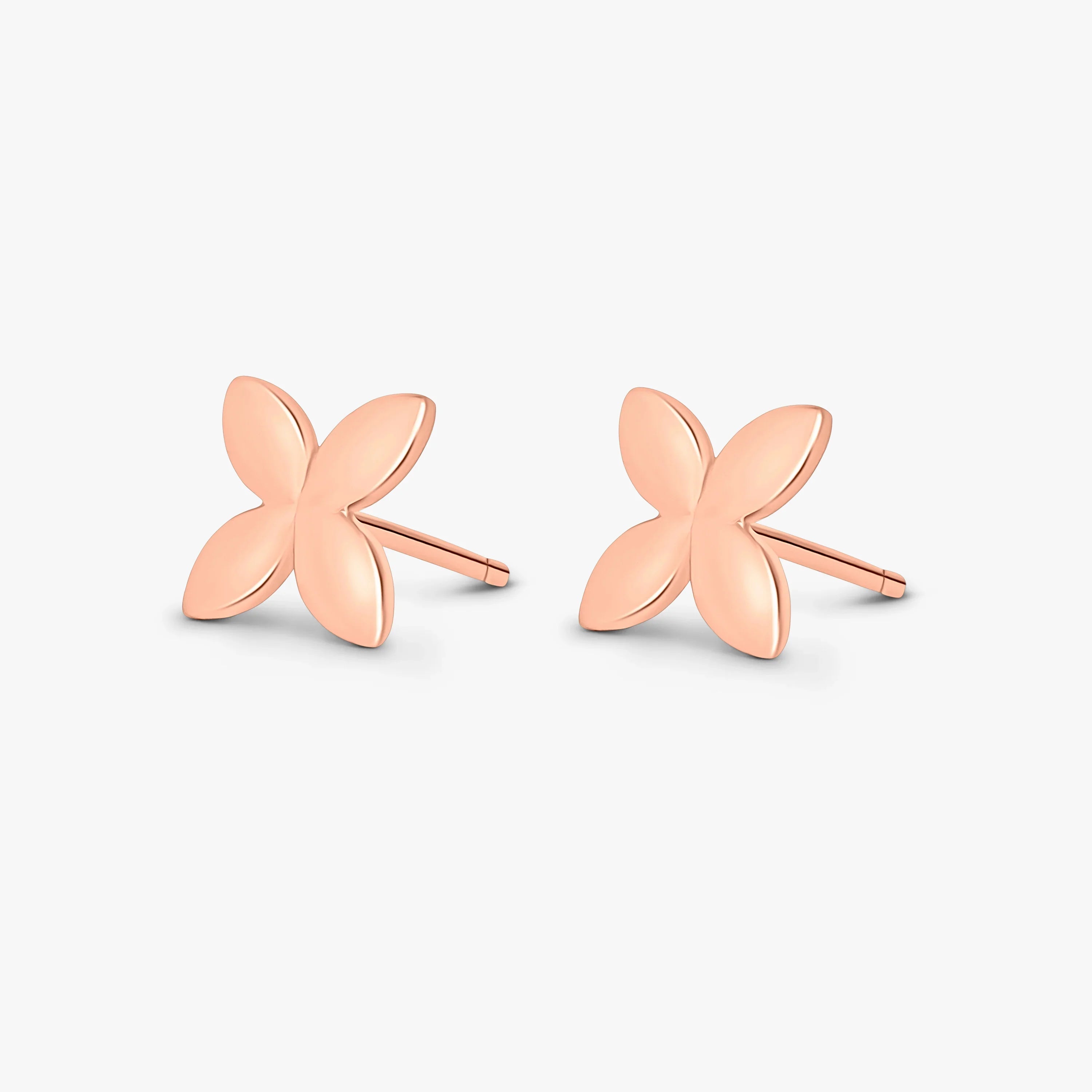 Rose gold butterfly stud earrings with four rounded petals, minimalist design