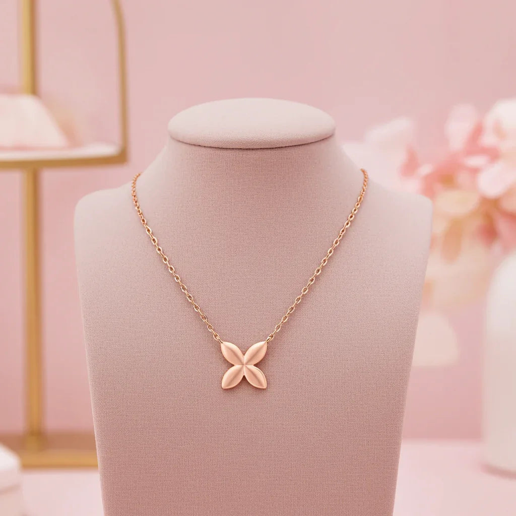 Minimalist rose gold butterfly necklace displayed on a pink fabric bust, elegant jewelry gift