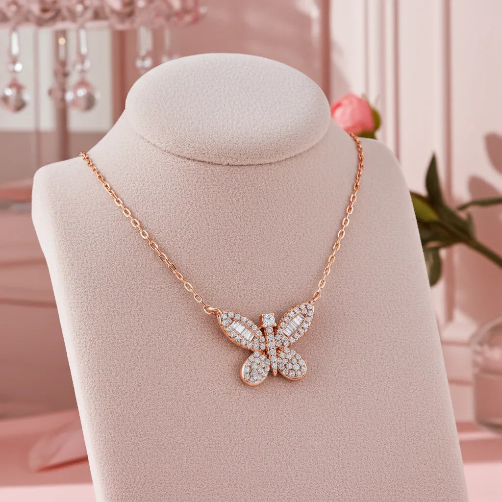 Rose gold butterfly pendant necklace with sparkling stones on display bust in elegant setting