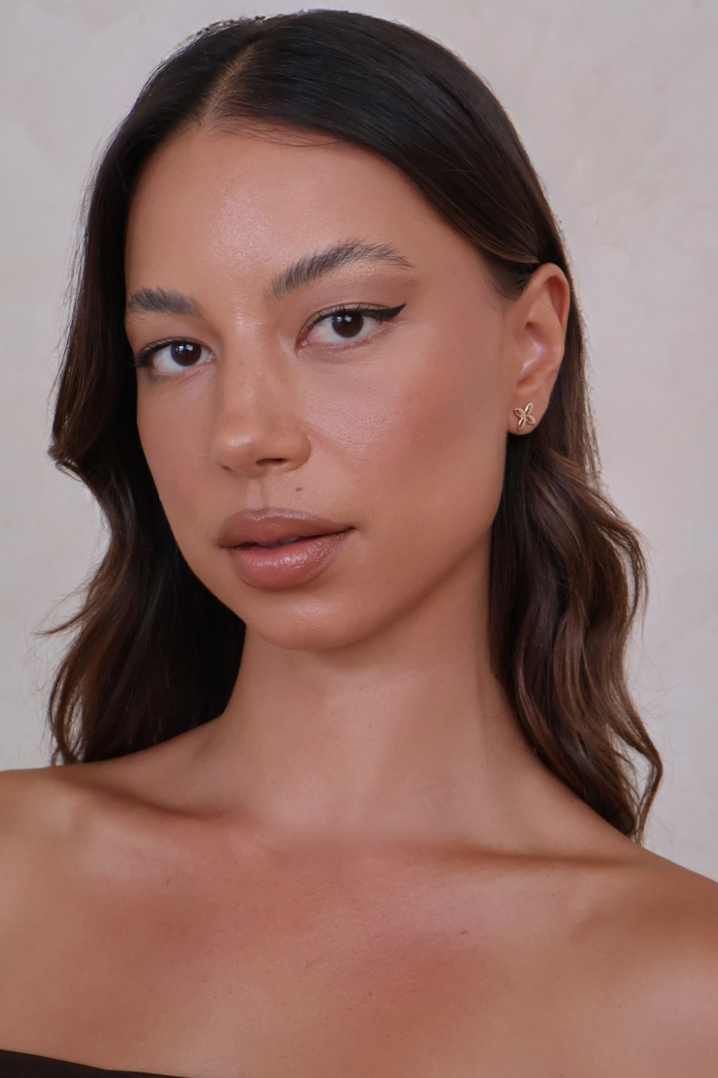 Close-up of a woman with a neutral background