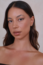 Close-up of a woman with a neutral background