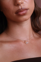 Chic butterfly necklace close up on a girl