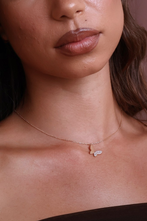 Chic butterfly necklace close up on a girl