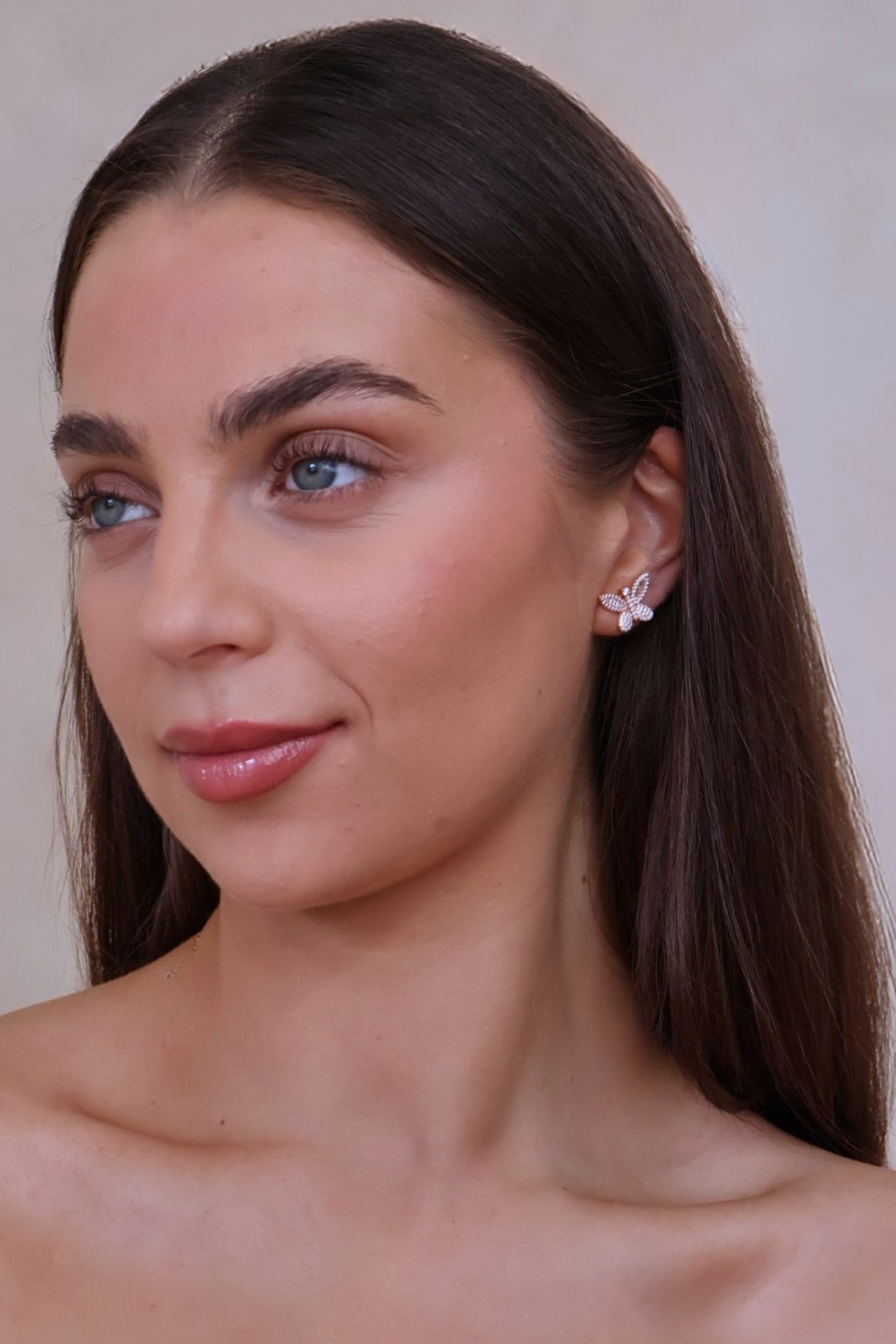 shimmering butterfly earrings on model