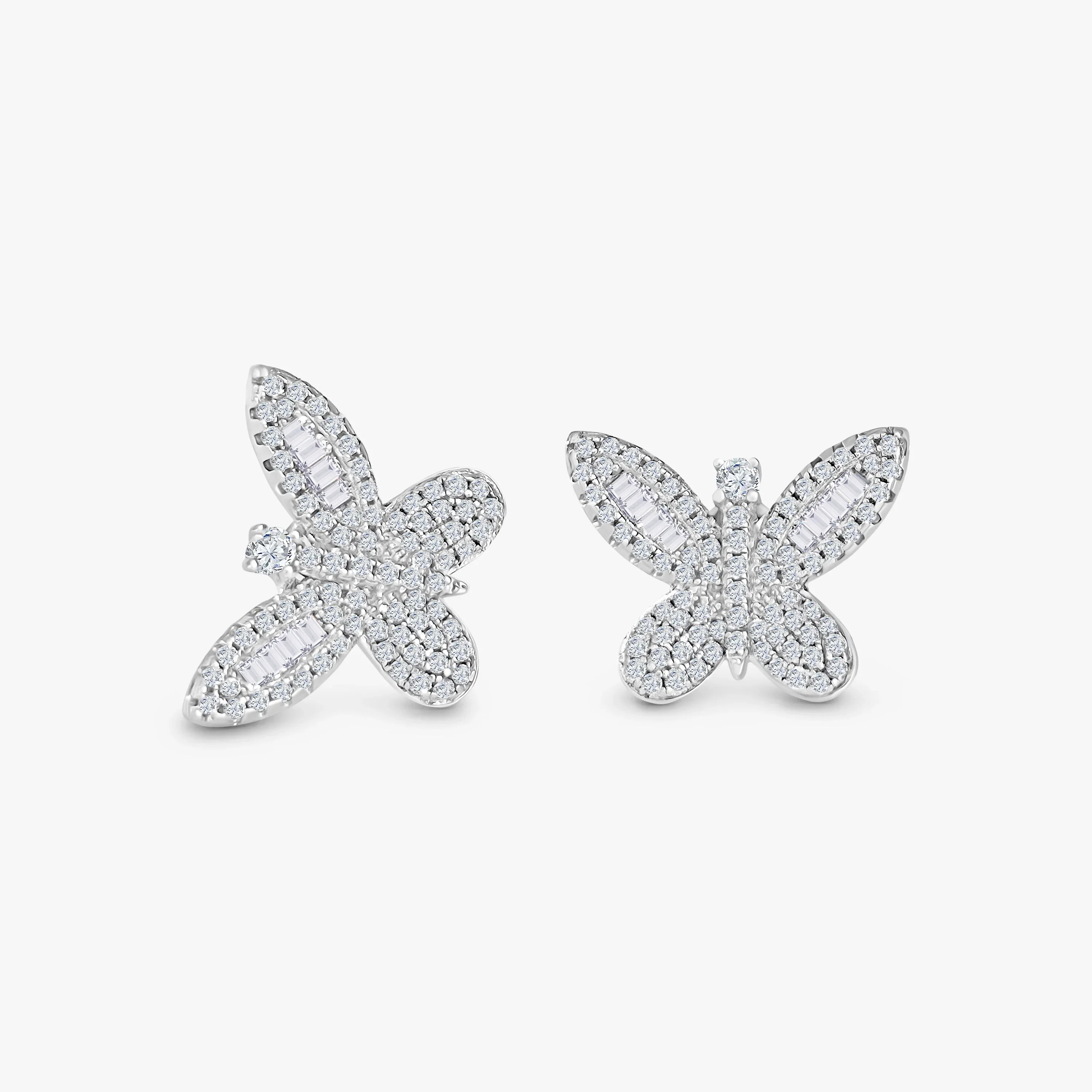 Marwa Jewels butterfly-shaped silver earrings encrusted with sparkling clear crystals on white background