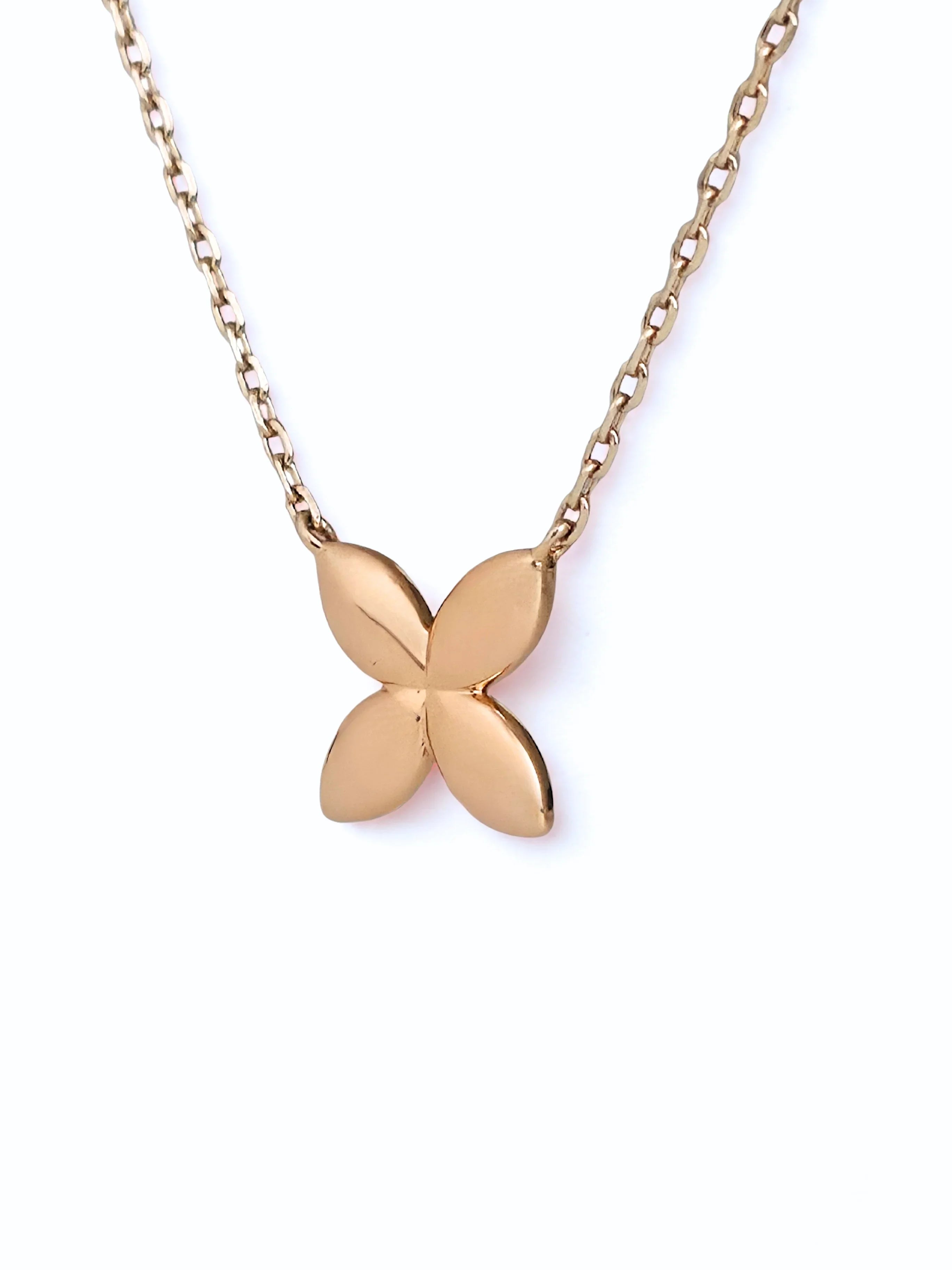 Rose gold butterfly necklace on a white background- front