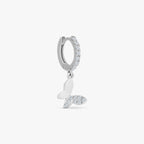 Silver hoop earring with clear crystals and a dangling butterfly charm featuring crystal accents