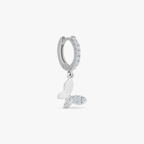 Silver hoop earring with clear crystals and a dangling butterfly charm featuring crystal accents
