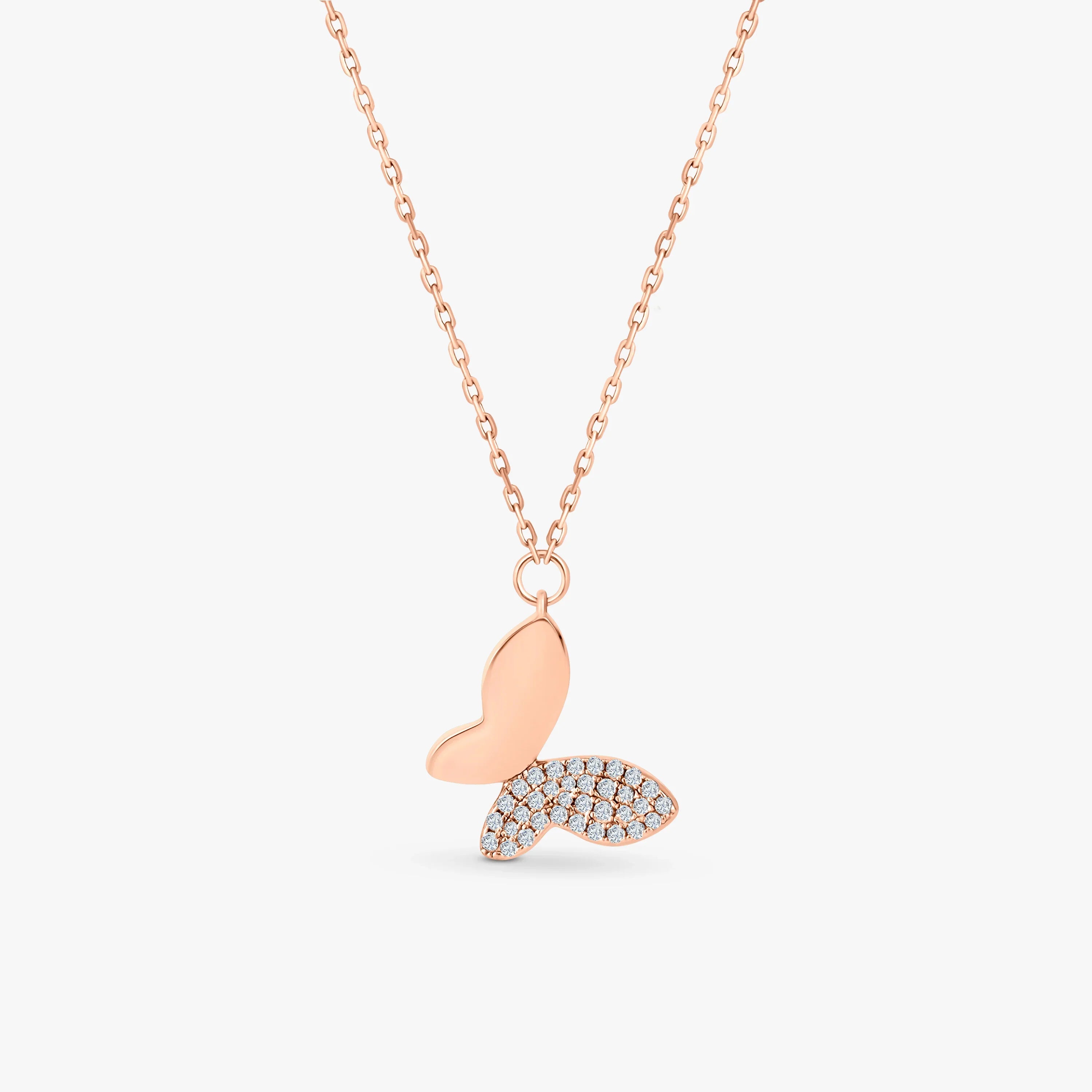 Rose gold butterfly pendant necklace with one wing adorned in diamonds, elegant jewellery gift