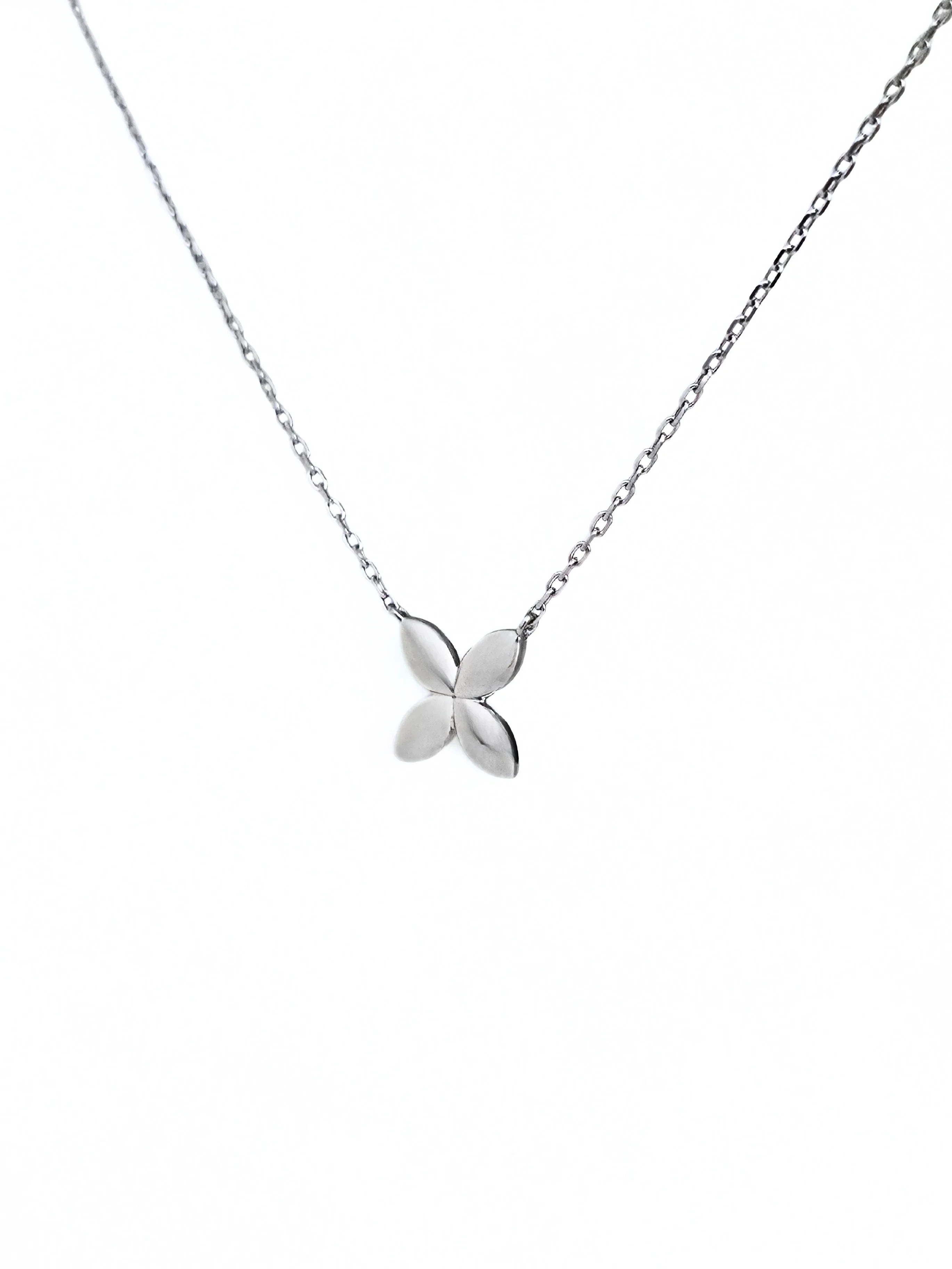 Silver butterfly necklace on a white background- side