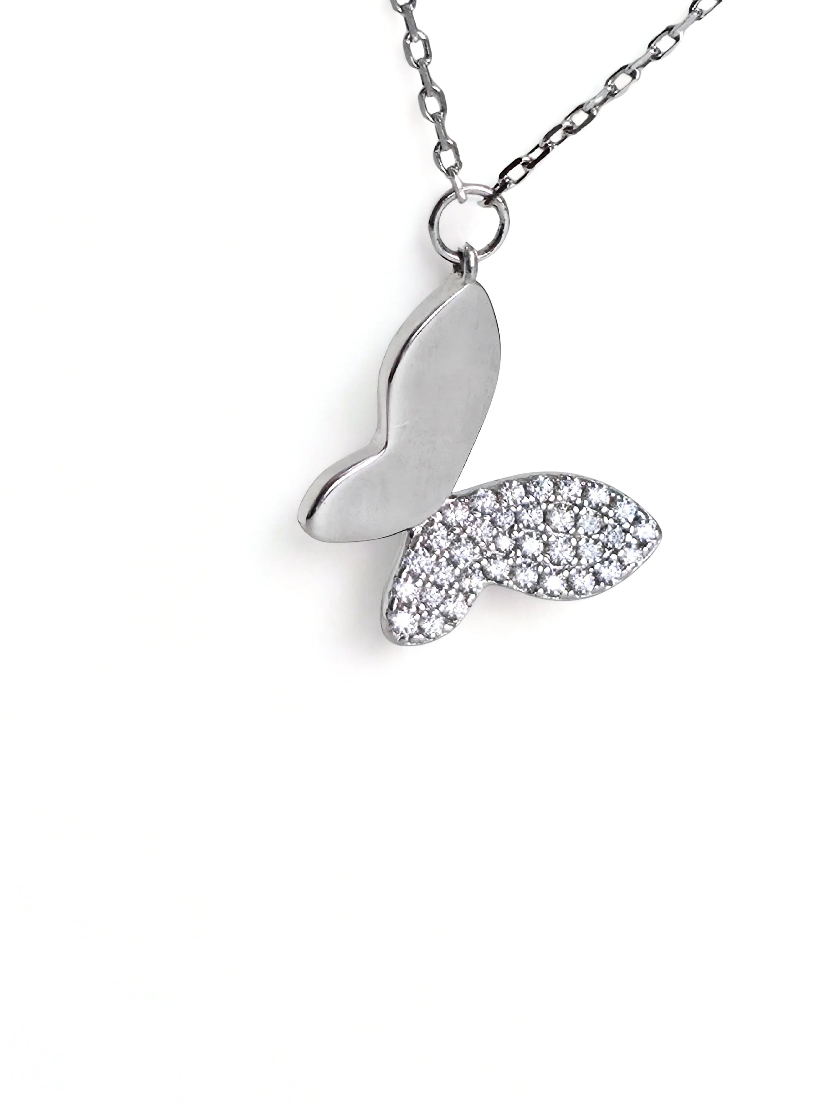 Silver butterfly necklace with diamond accents on a white background- chic butterfly necklace silver - further