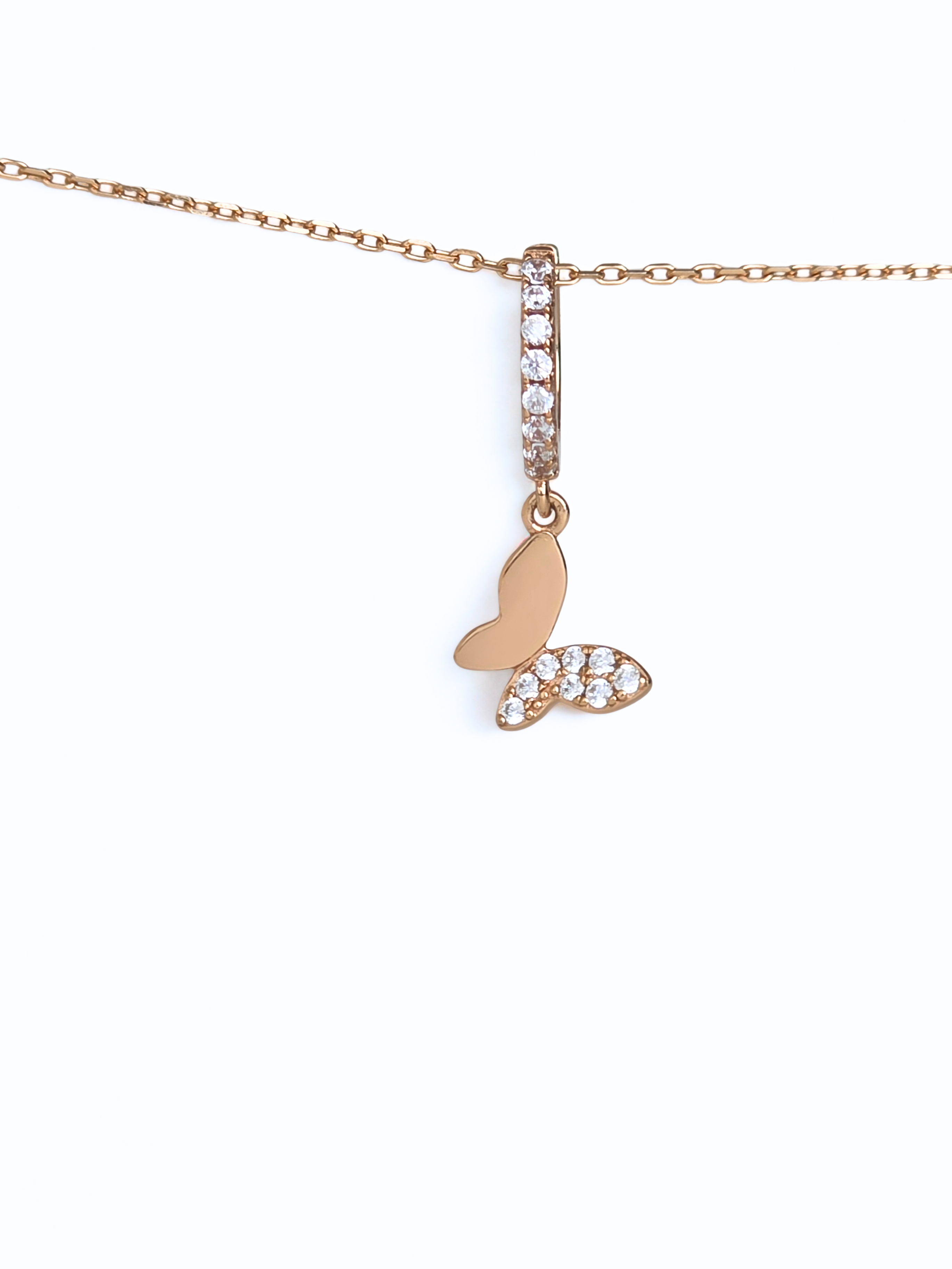 Rose gold necklace with a butterfly pendant on a white background- butterfly huggies - rose gold