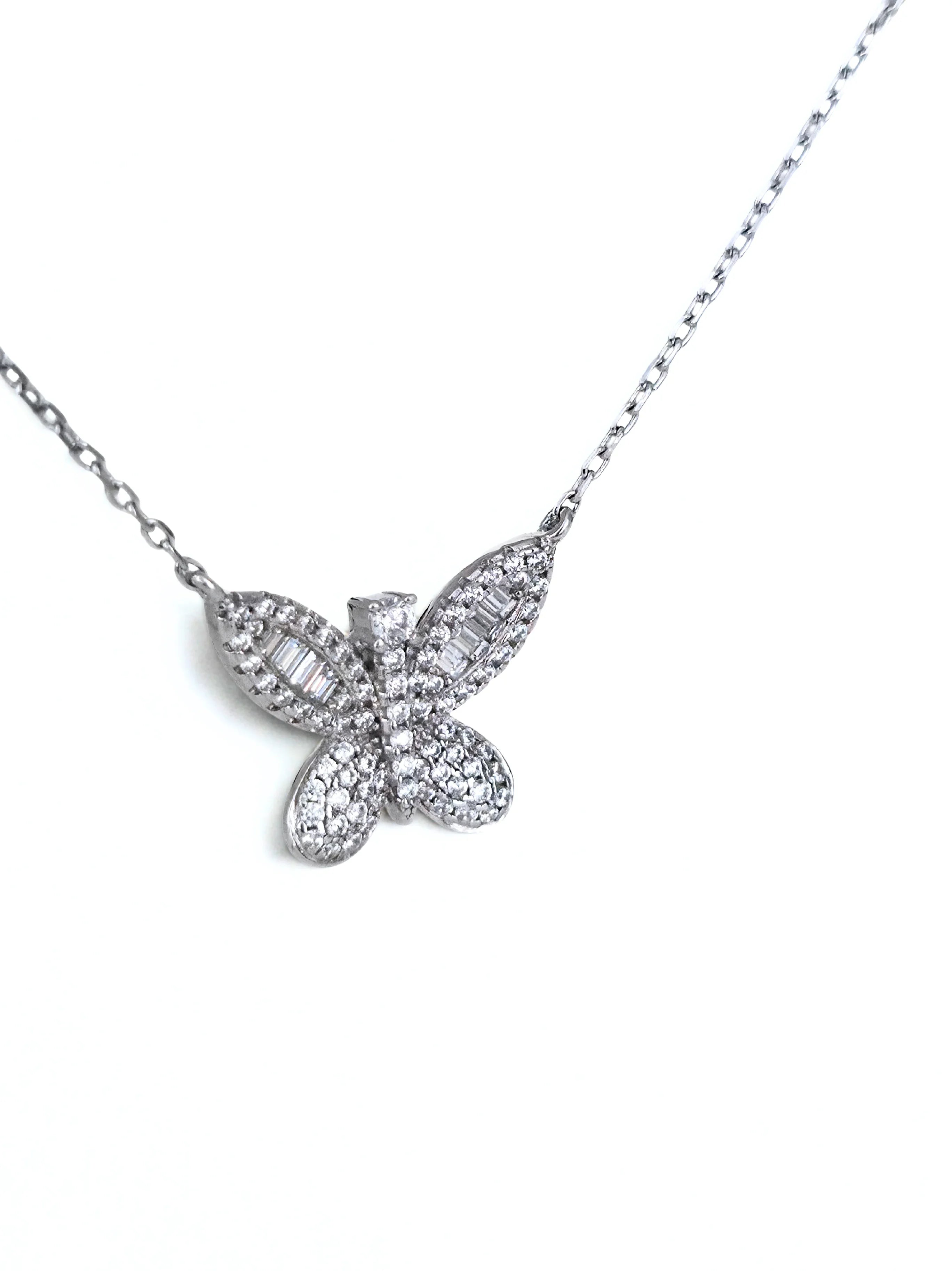 Butterfly-shaped diamond necklace on a white background- shimmering butterfly silver- side ways