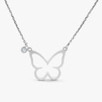 Silver butterfly pendant necklace with a small clear gemstone accent on delicate chain