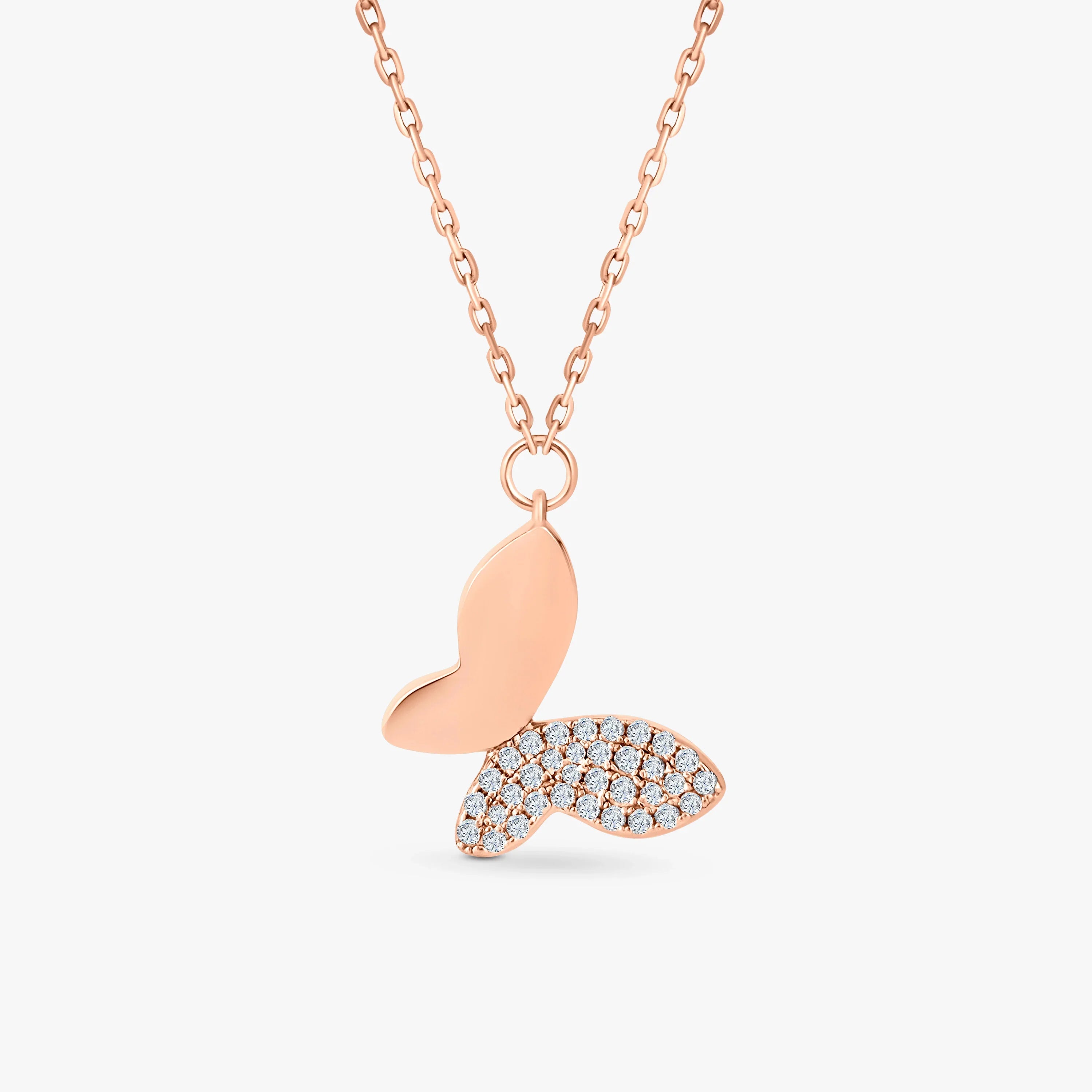 Rose gold butterfly pendant necklace with half pave diamond wings on chain